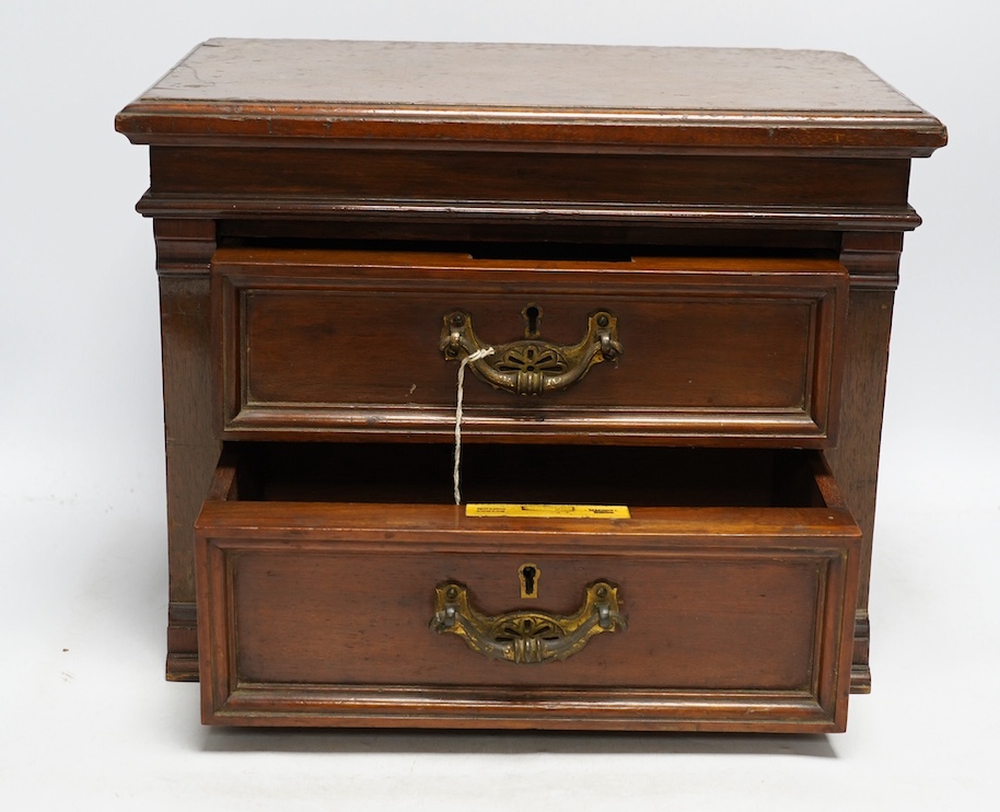 A Victorian mahogany two drawer table top cabinet, 37cm. Condition - fair